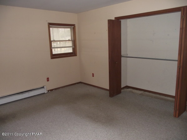 52 Seneca Road Mount Pocono, PA 18344 - Photo 3 of 16 a view of an empty room with a window