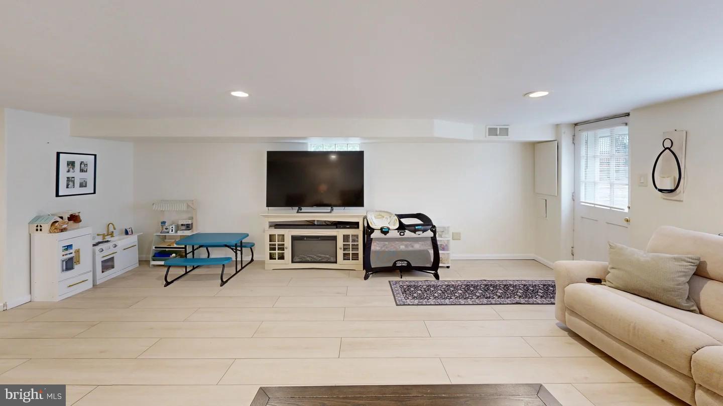 3137 Draper Street Philadelphia, PA 19136 - Photo 16 of 39 a living room with furniture and a flat screen tv
