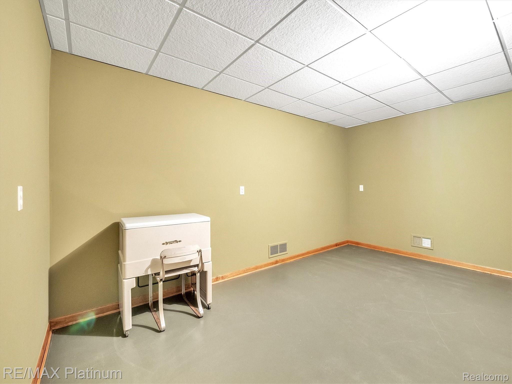 11061 Wiggins Road Howell, MI 48855 - Photo 34 of 79 LARGE WORK ROOM, IRON STAYS