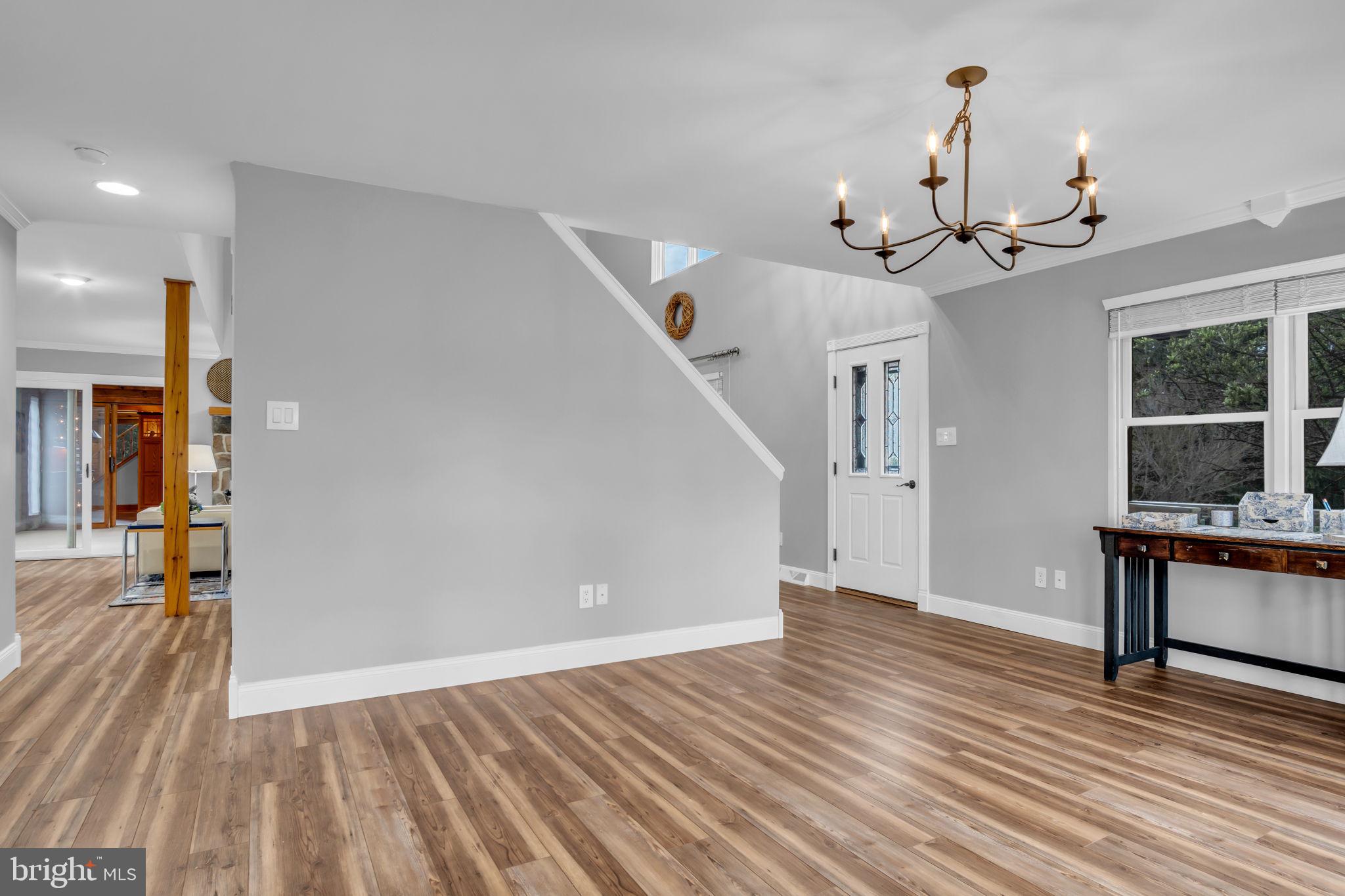 254 Stuart Road Carlisle, PA 17015 - Photo 54 of 102 a view of a livingroom with a furniture wooden floor and window