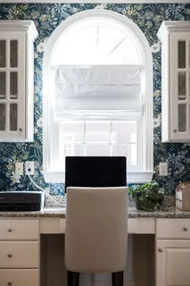 a view of a hallway with wooden floor and stairs