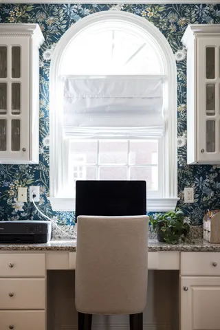 a view of a hallway with wooden floor and stairs