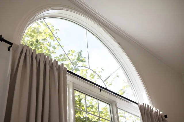 a bedroom with a bed and a lamp on table