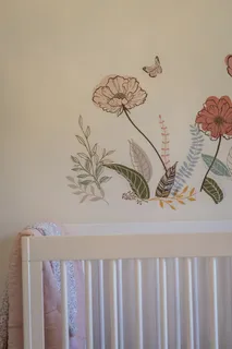 a living room with furniture a fireplace and a large window