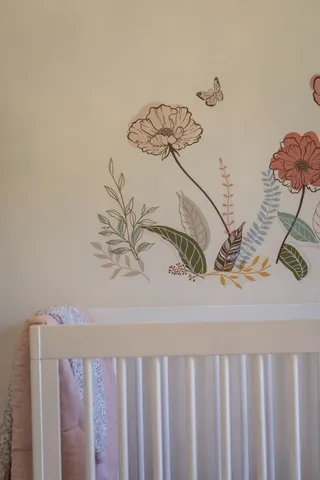 a living room with furniture a fireplace and a large window