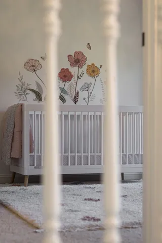 a view of a roof deck with table and chairs and wooden floor