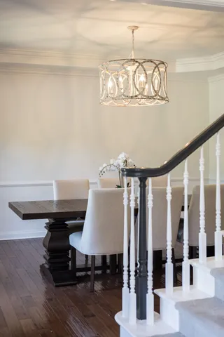 a kitchen with stainless steel appliances kitchen island granite countertop a refrigerator and a stove top oven