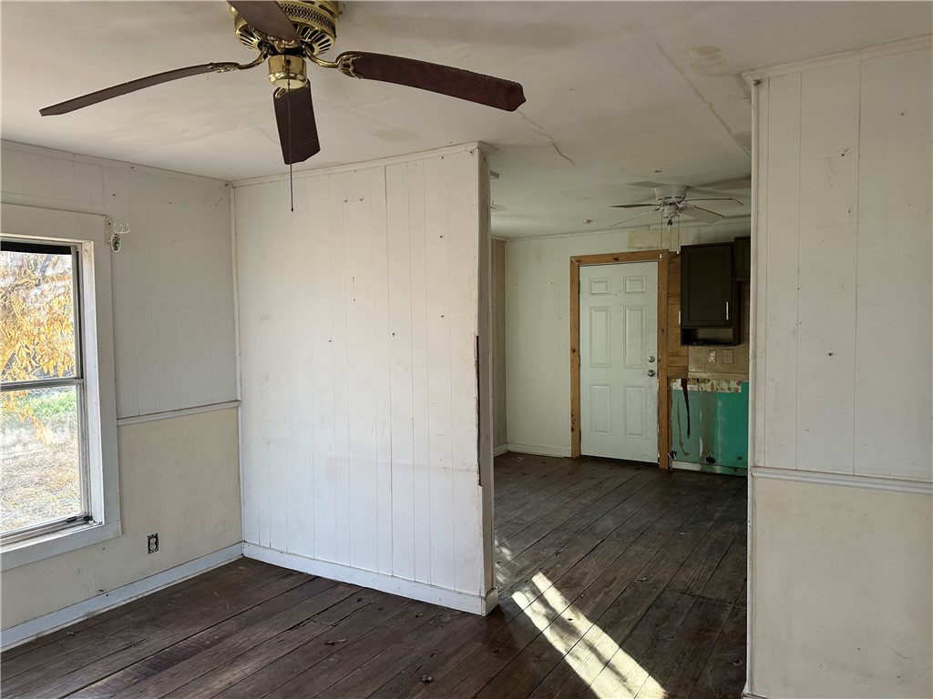 308 Mc Guill Street Refugio, TX 78377 - Photo 11 of 28 a view of empty room with wooden floor and fan