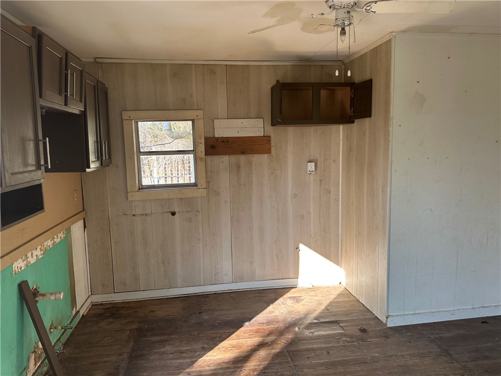 308 Mc Guill Street Refugio, TX 78377 - Photo 14 of 28 a view of an empty room with a window and wooden floor