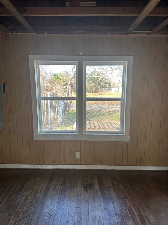 308 Mc Guill Street Refugio, TX 78377 - Photo 18 of 28 a view of an empty room with wooden floor and a window