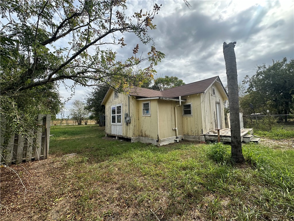 308 Mc Guill Street Refugio, TX 78377 - Photo 4 of 28 a front view of a house with a yard