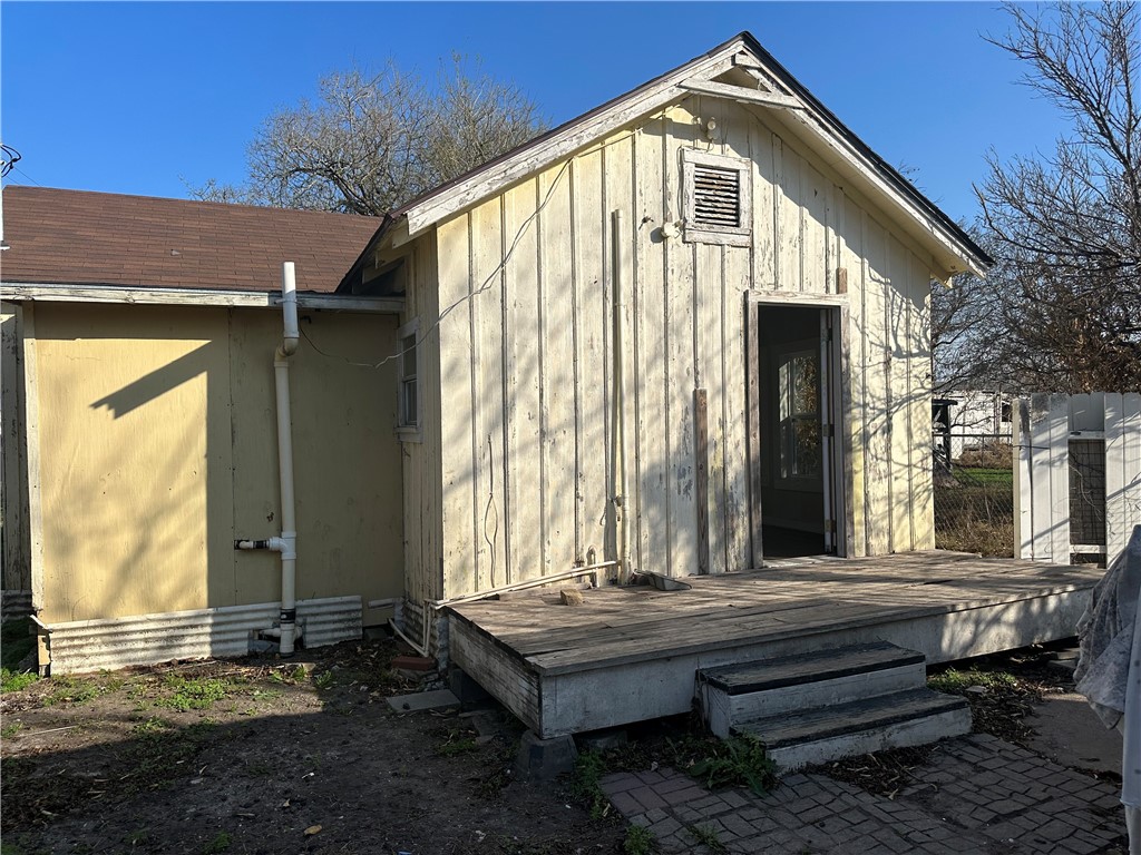 308 Mc Guill Street Refugio, TX 78377 - Photo 7 of 28 a front view of a house with a wooden floor and a porch