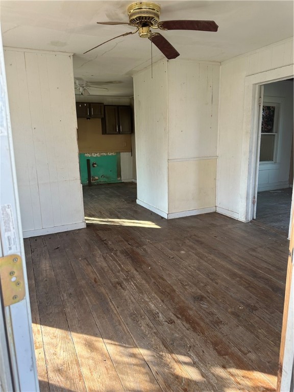 308 Mc Guill Street Refugio, TX 78377 - Photo 10 of 28 an empty room with wooden floor a ceiling fan and entryway