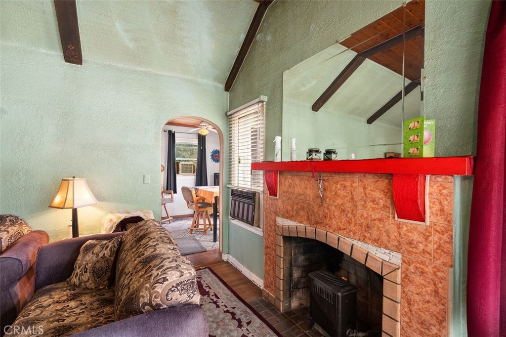 330 El Nido Avenue Pasadena, CA 91107 - Photo 11 of 41 a bedroom with a bed and a fireplace