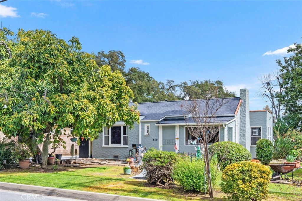 330 El Nido Avenue Pasadena, CA 91107 - Photo 32 of 41 a view of a big yard in front of a brick house with large windows