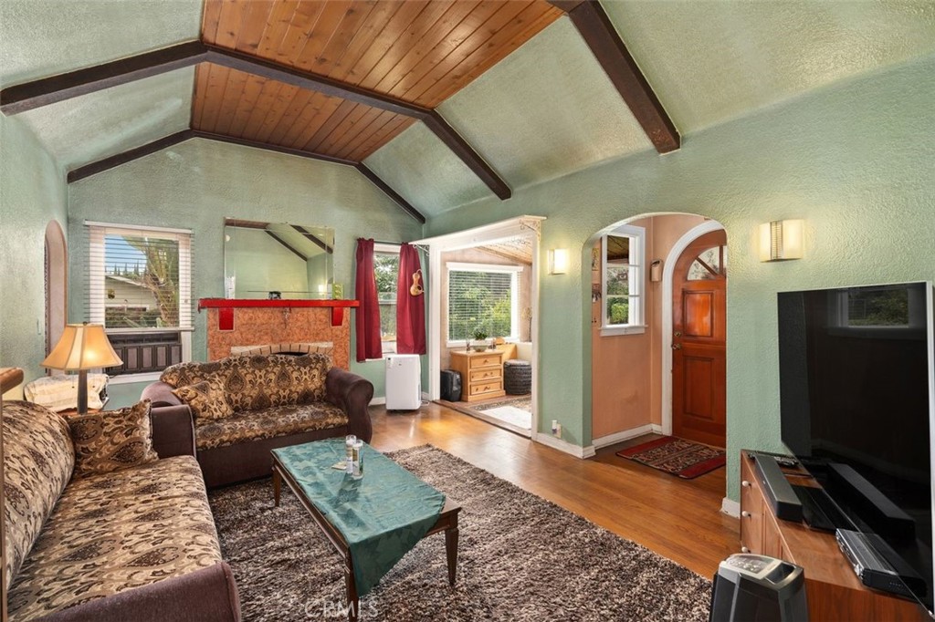 330 El Nido Avenue Pasadena, CA 91107 - Photo 10 of 41 a living room with furniture a flat screen tv and a table