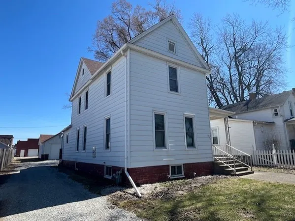 a view of house with yard