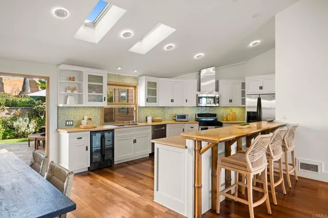 a balcony with furniture and a large window