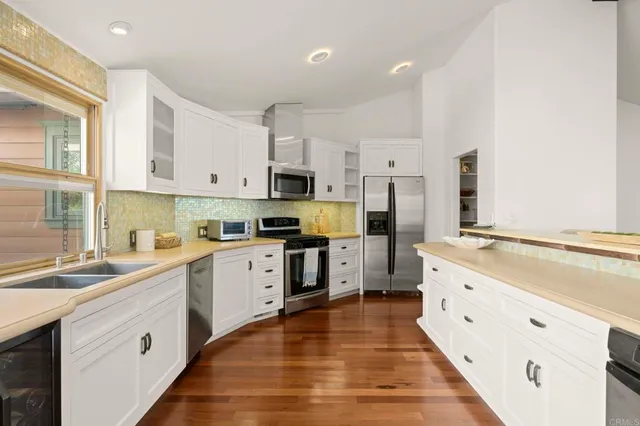 a bathroom with a double vanity sink and mirror