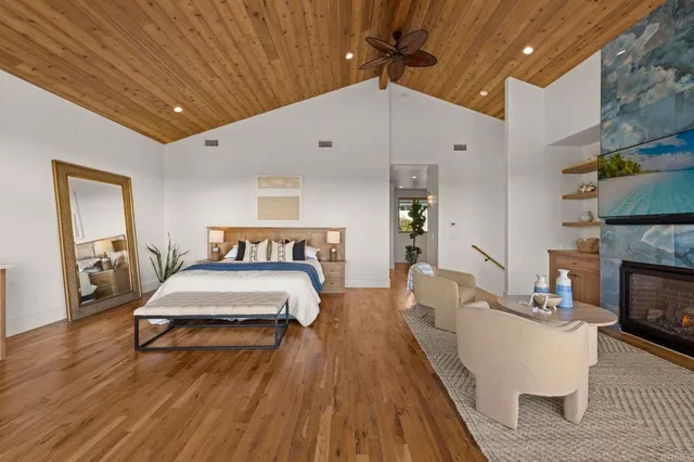 a bedroom with a bed and cabinets