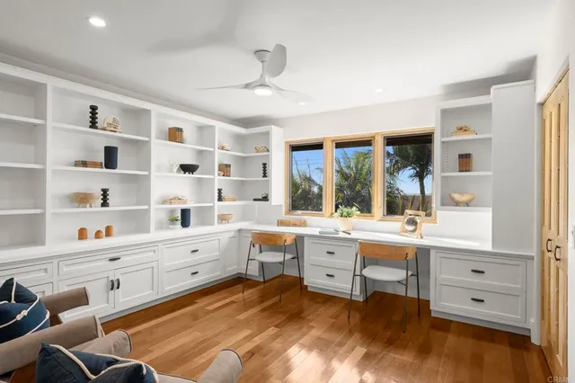 a view of a house with backyard sitting area and garden