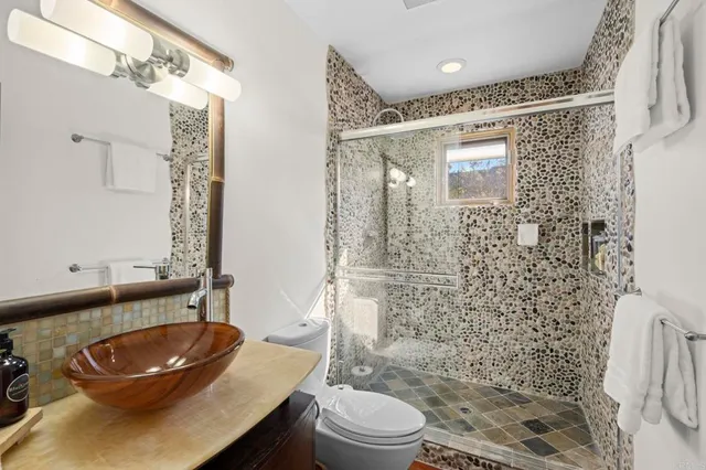 a view of swimming pool with outdoor seating and city view