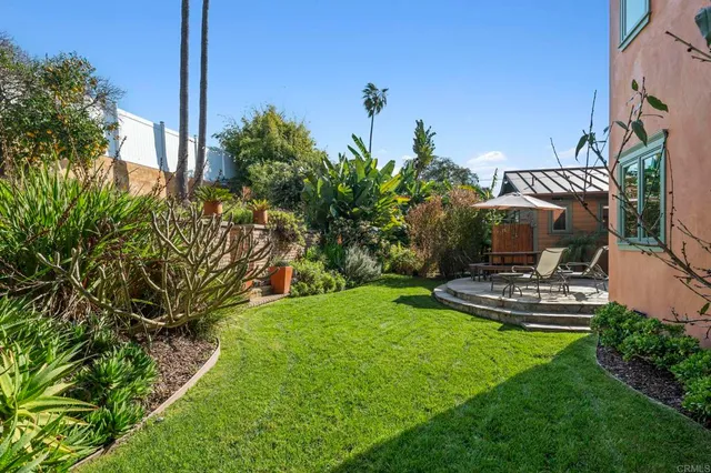 a balcony with furniture and view of city