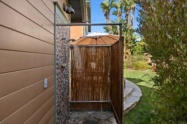 a backyard of a house with outdoor seating