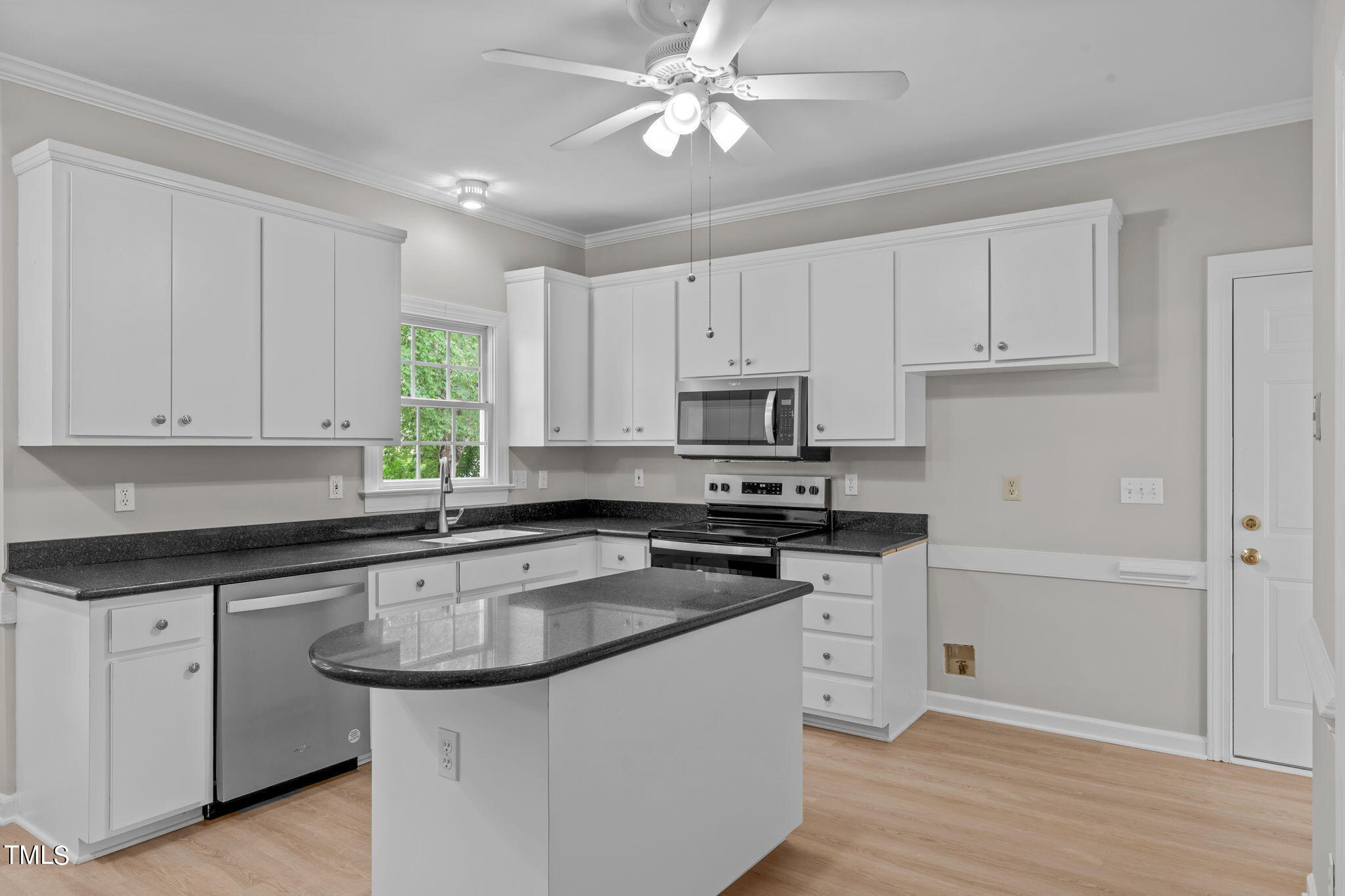 206 Palace Green Cary, NC 27518 - Photo 11 of 51 a kitchen with white cabinets stainless steel appliances and sink