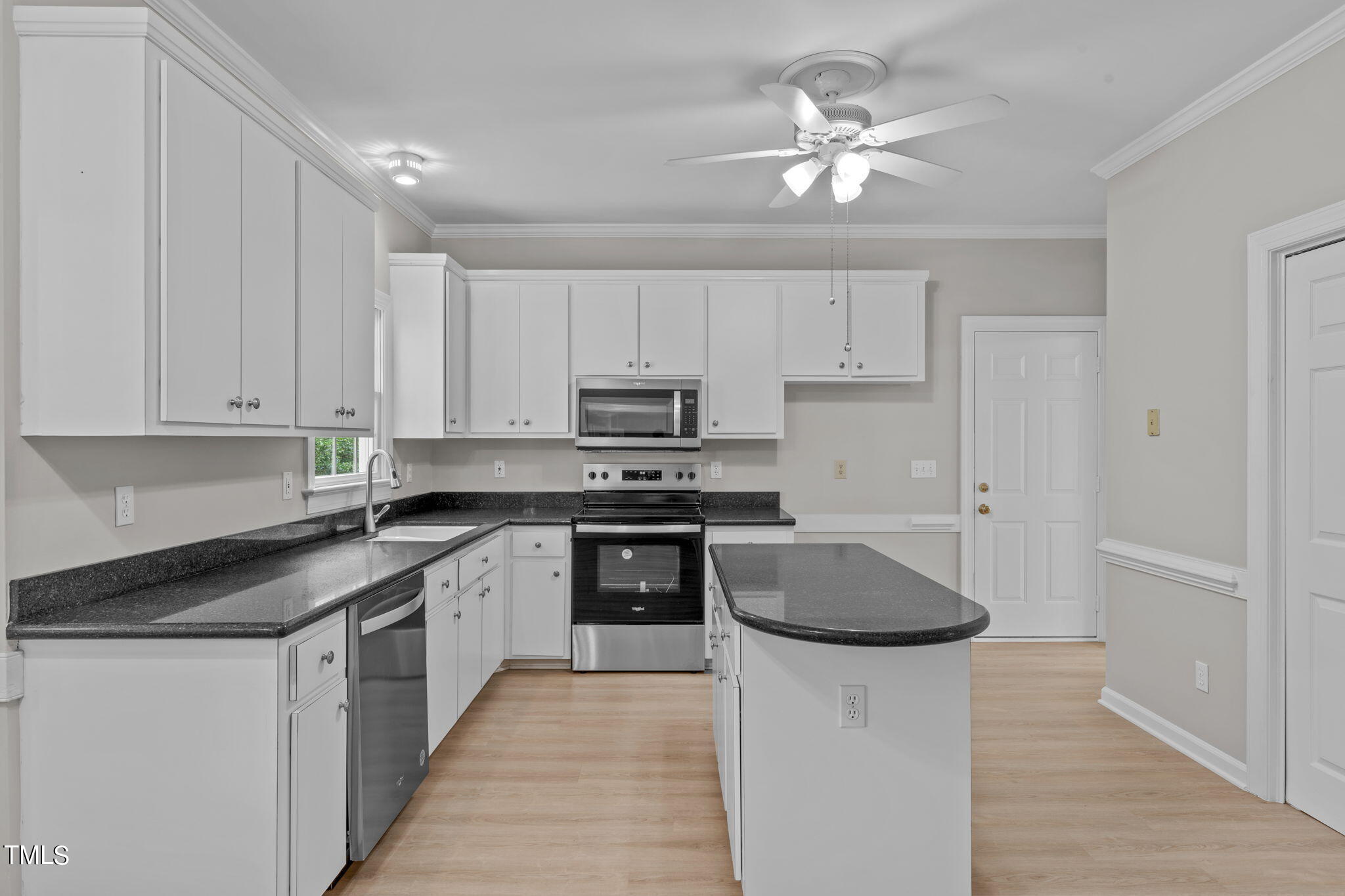 206 Palace Green Cary, NC 27518 - Photo 12 of 51 a kitchen with granite countertop a sink a stove and cabinets