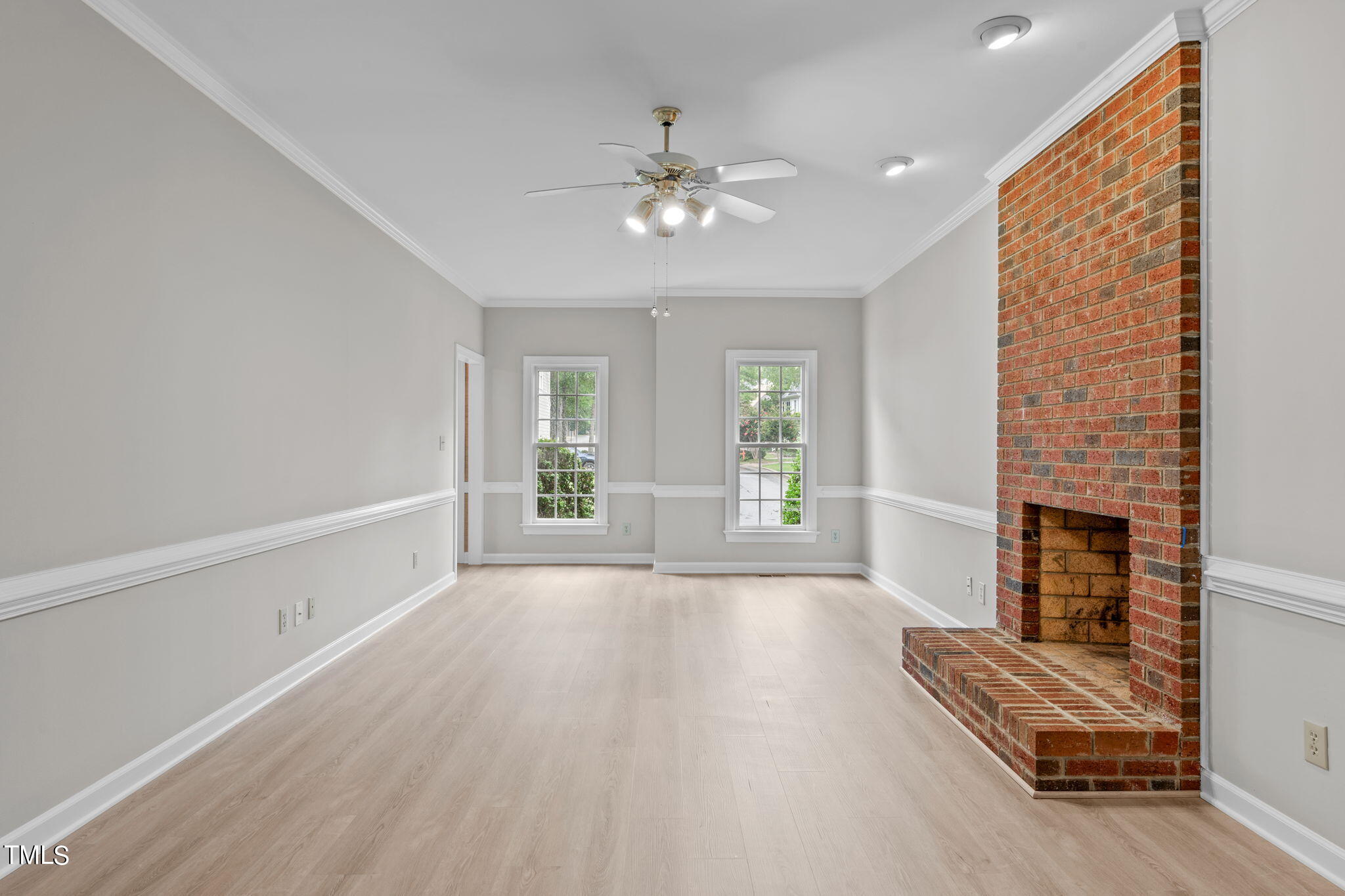 206 Palace Green Cary, NC 27518 - Photo 18 of 51 wooden floor in an empty room with a fireplace