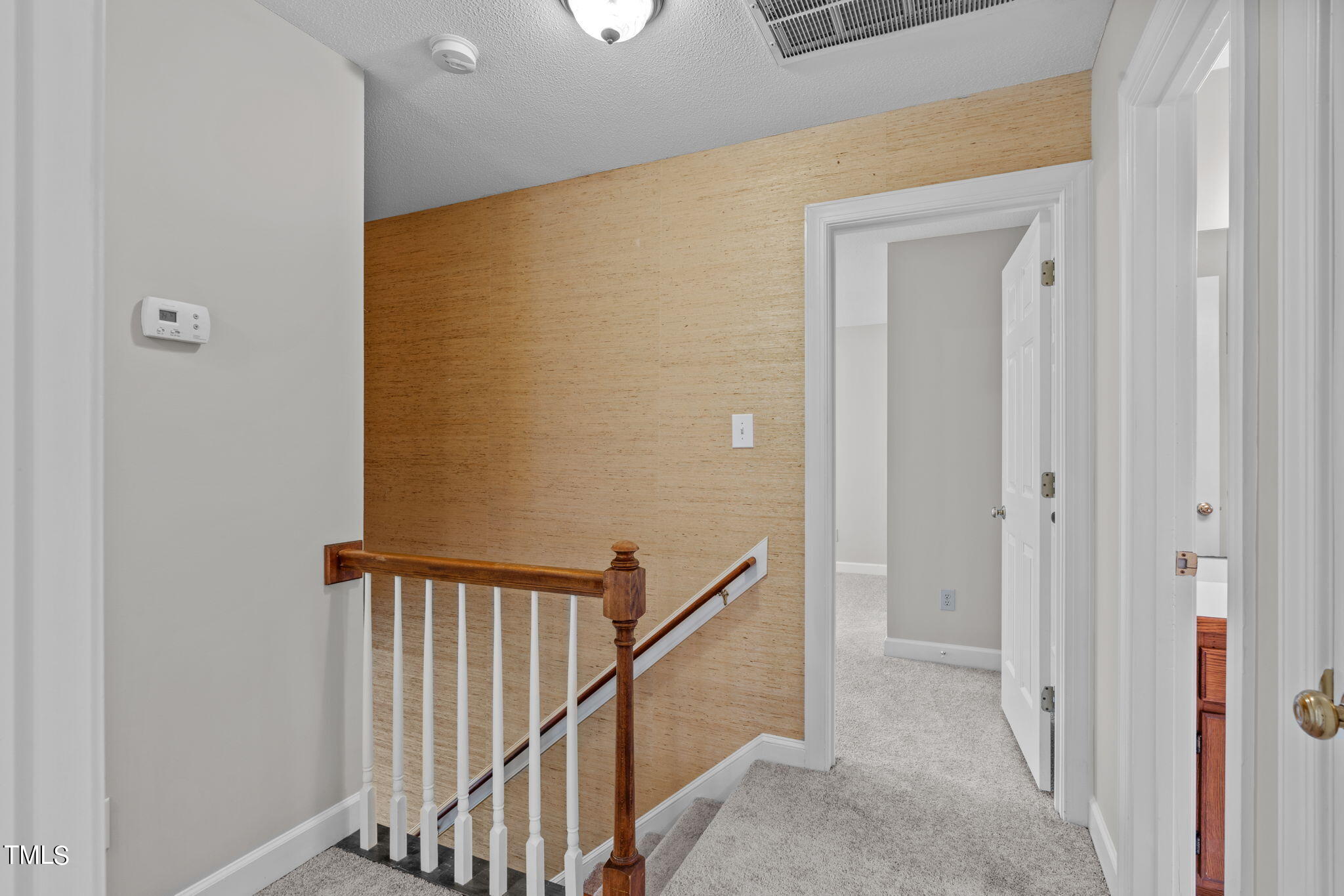 206 Palace Green Cary, NC 27518 - Photo 25 of 51 a view of a hallway with wooden floor and entryway