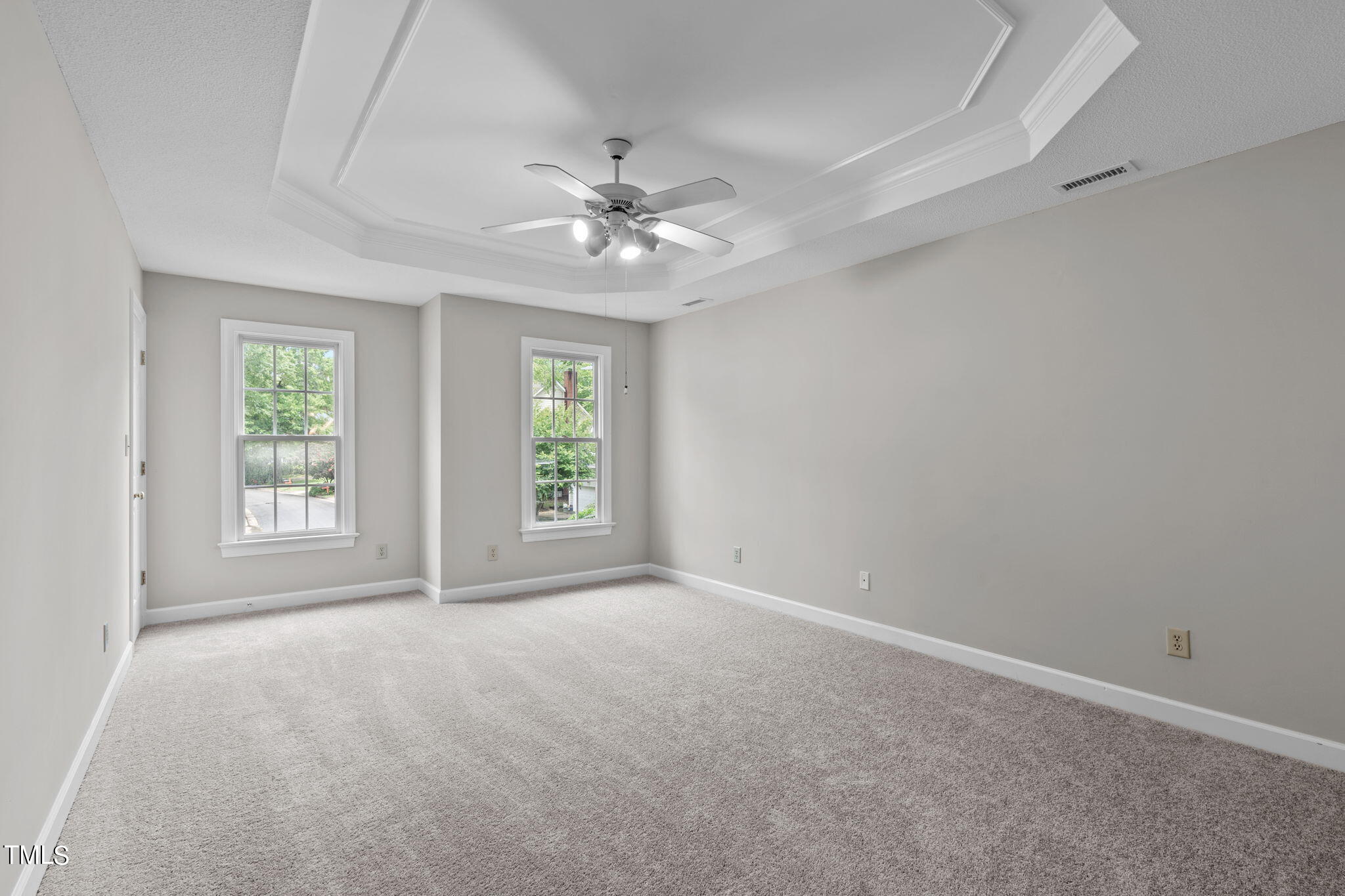 206 Palace Green Cary, NC 27518 - Photo 27 of 51 an empty room with chandelier fan and windows