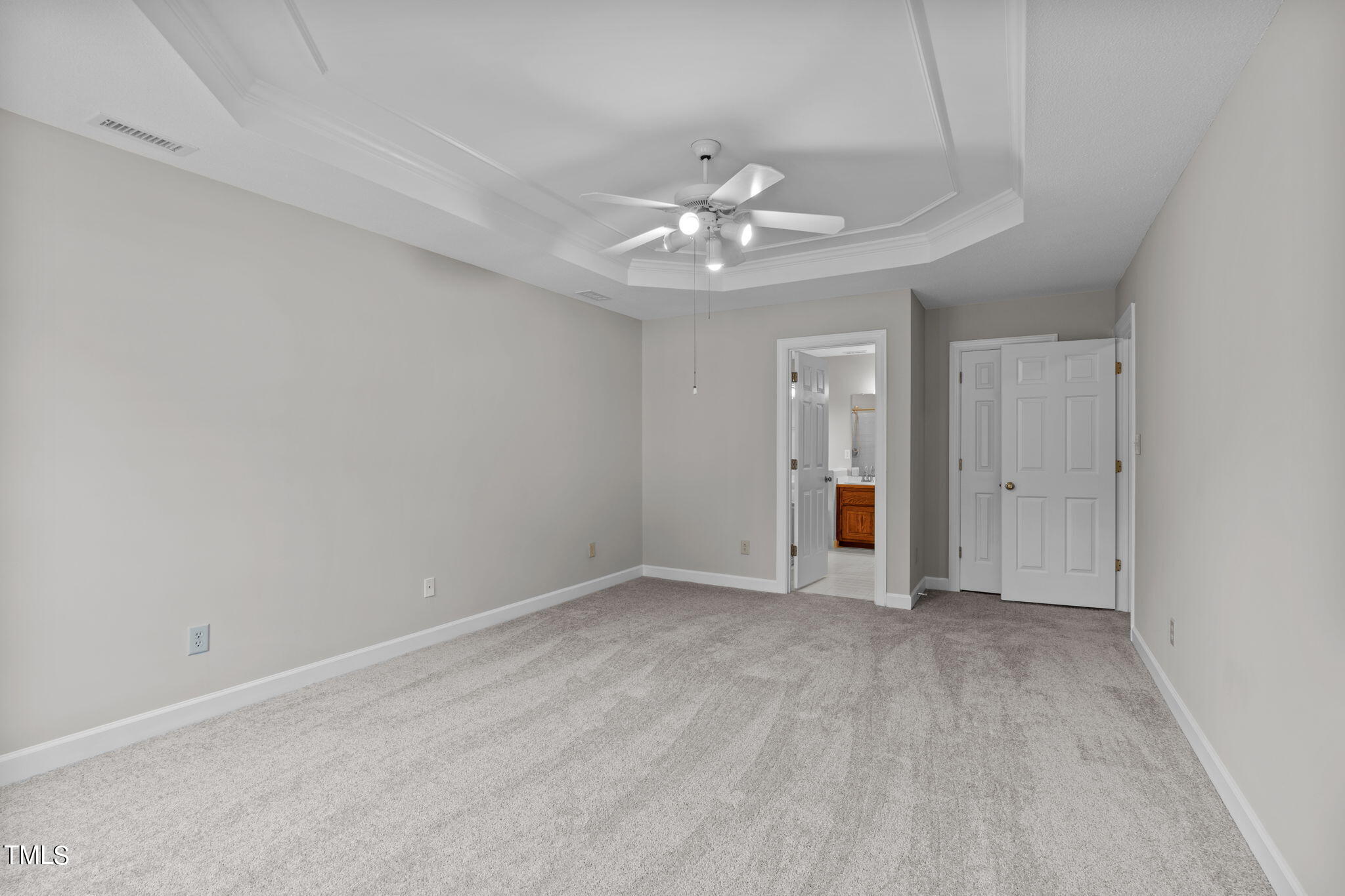 206 Palace Green Cary, NC 27518 - Photo 28 of 51 an empty room with an entryway and chandelier fan