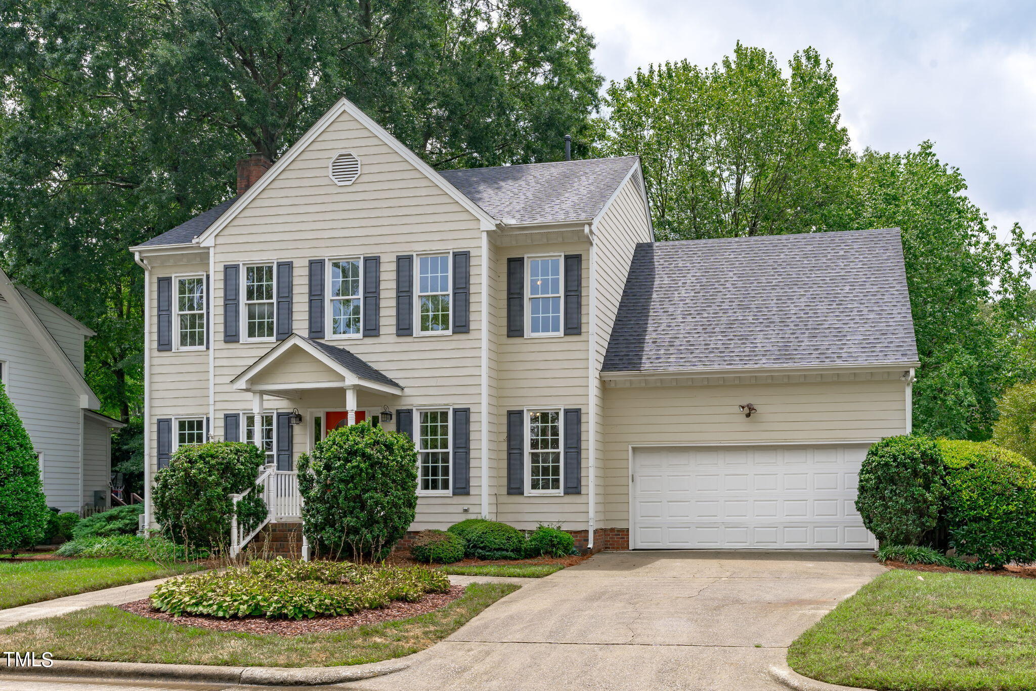 206 Palace Green Cary, NC 27518 - Photo 3 of 51 a front view of a house with a yard and trees