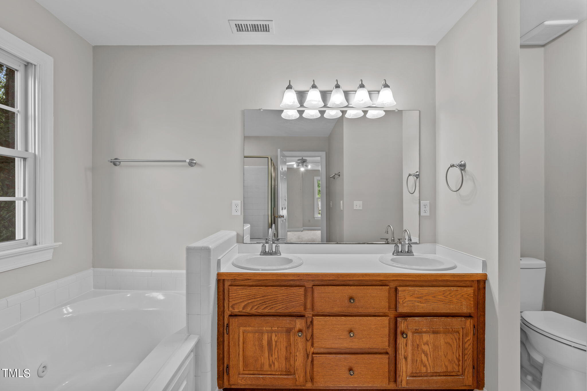 206 Palace Green Cary, NC 27518 - Photo 33 of 51 a bathroom with a sink double vanity granite tub and a mirror