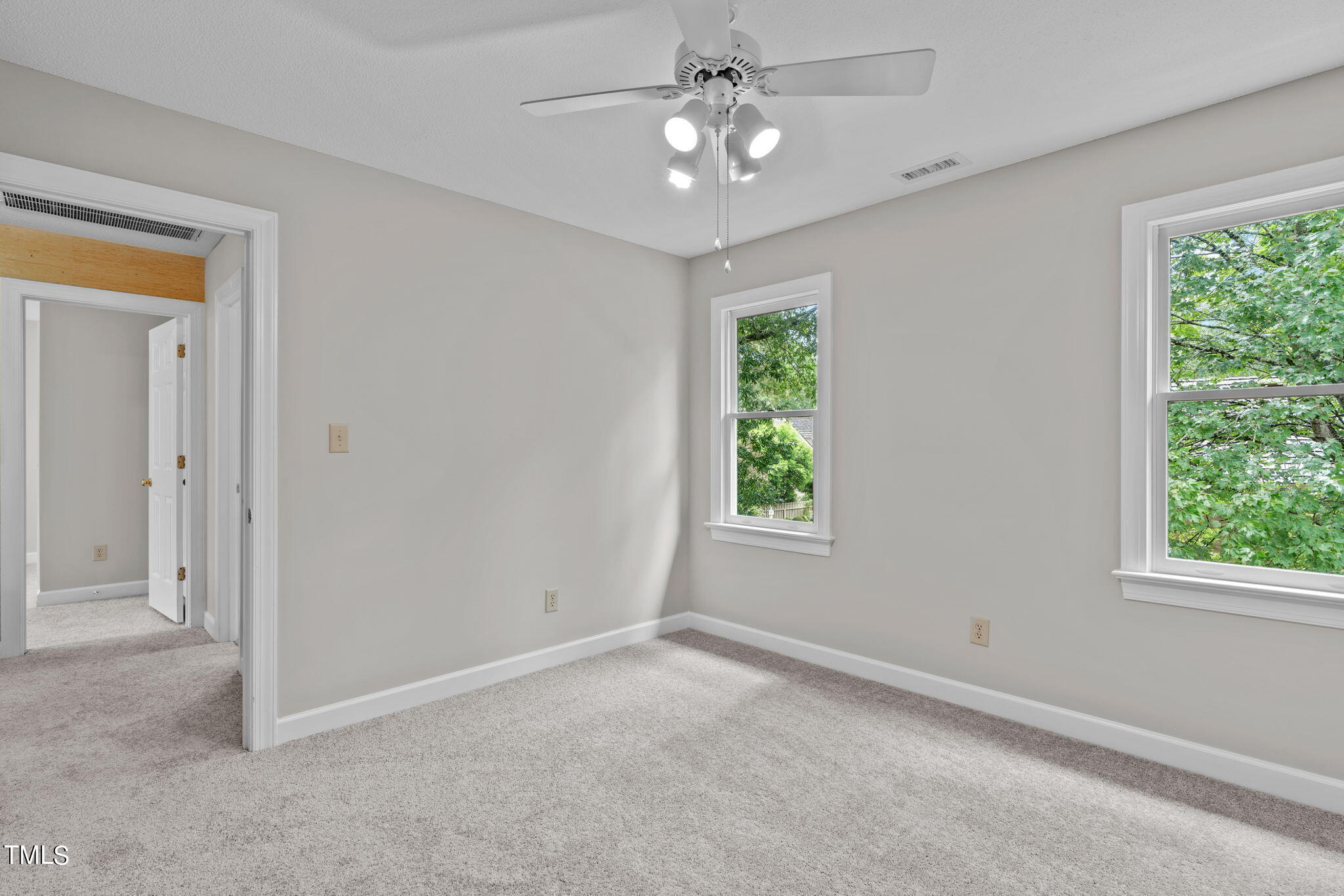 206 Palace Green Cary, NC 27518 - Photo 34 of 51 an empty room with a window and a fan