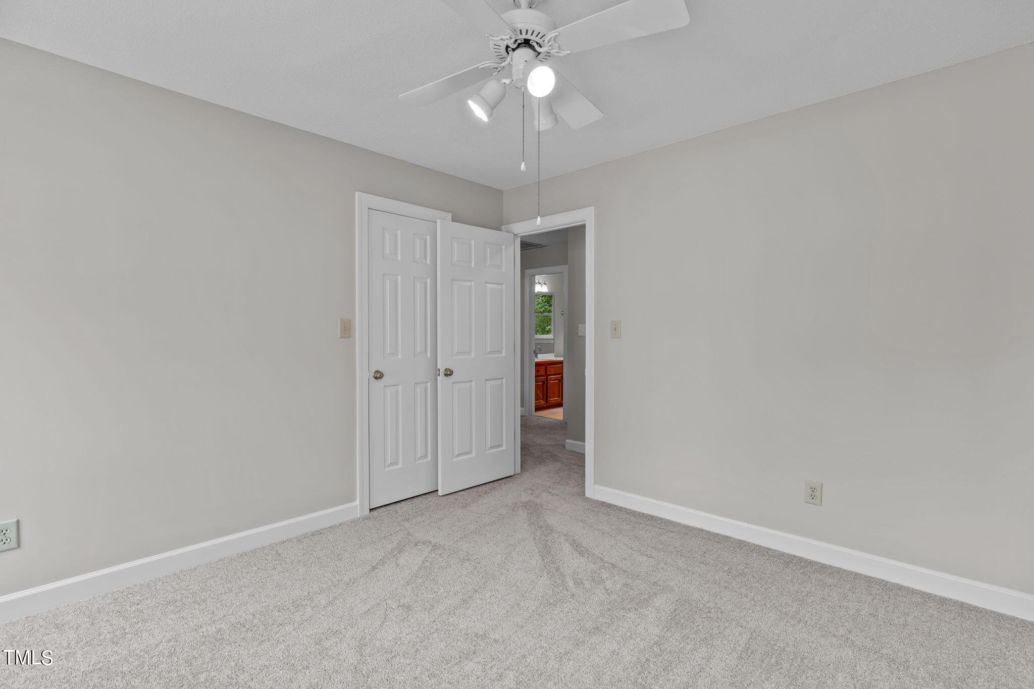 206 Palace Green Cary, NC 27518 - Photo 36 of 51 an empty room with chandelier fan and closet area