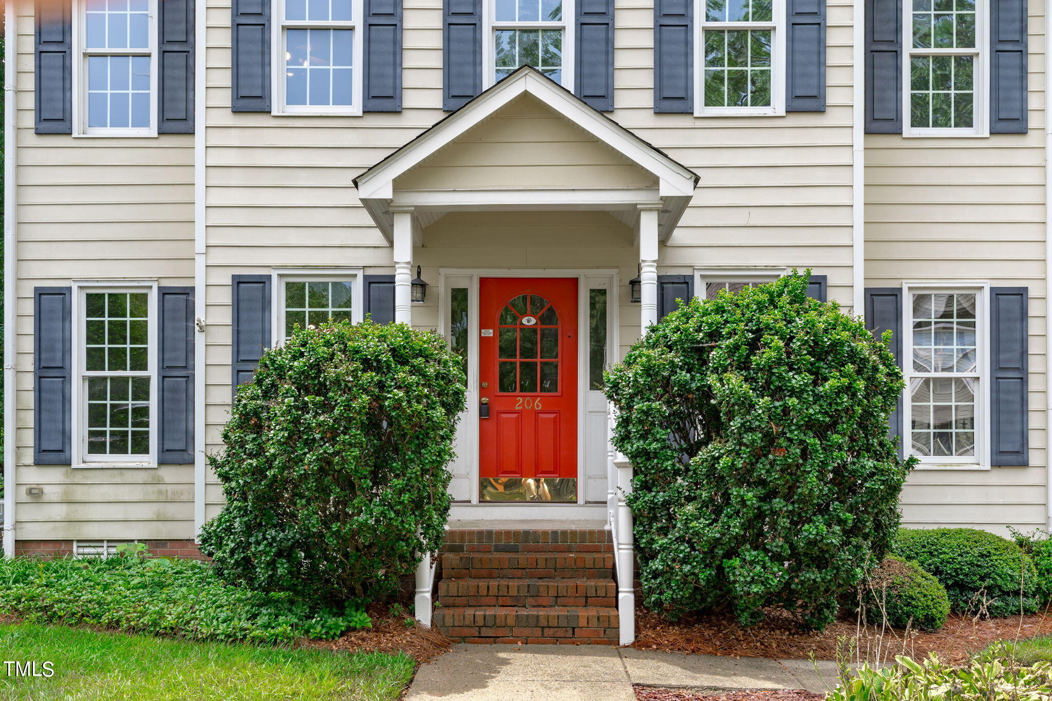 206 Palace Green Cary, NC 27518 - Photo 4 of 51 a front view of a house with garden