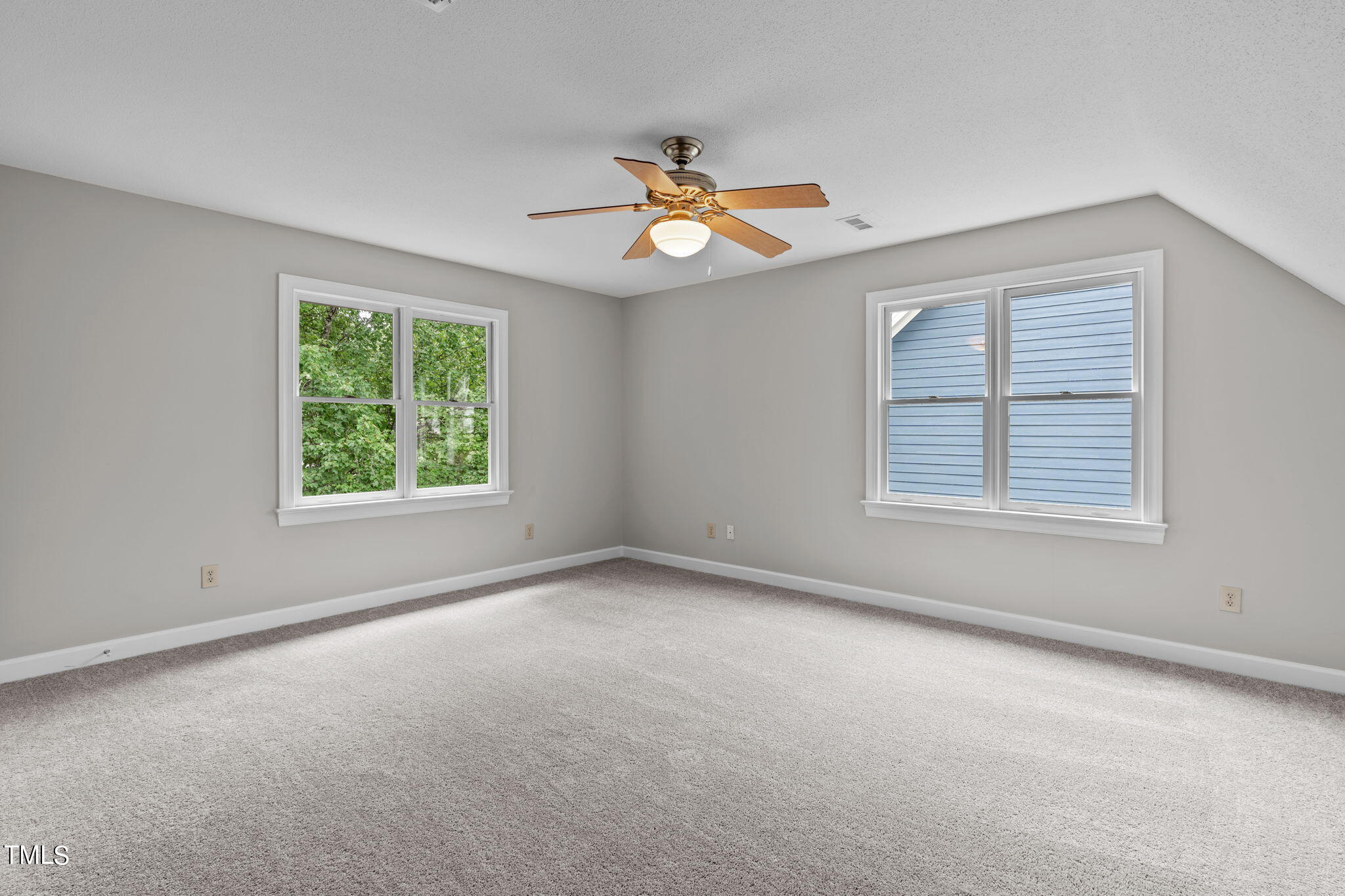 206 Palace Green Cary, NC 27518 - Photo 41 of 51 an empty room with windows and fan