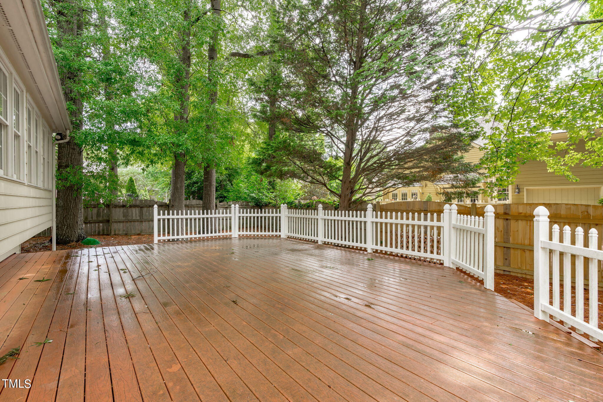 206 Palace Green Cary, NC 27518 - Photo 44 of 51 a view of a deck with a large window and wooden floor