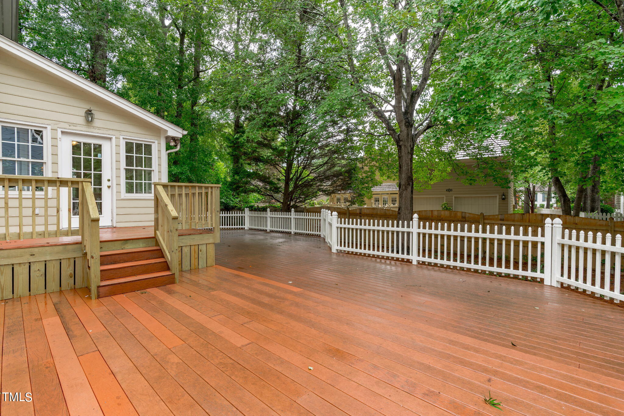 206 Palace Green Cary, NC 27518 - Photo 45 of 51 a view of a deck with wooden floor and fence