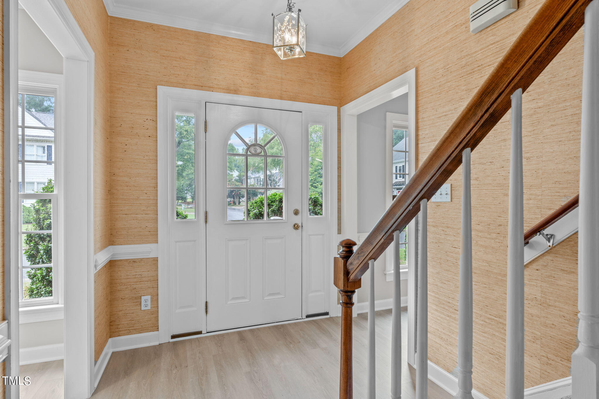 206 Palace Green Cary, NC 27518 - Photo 5 of 51 a view of an entryway with wooden floor and stairs