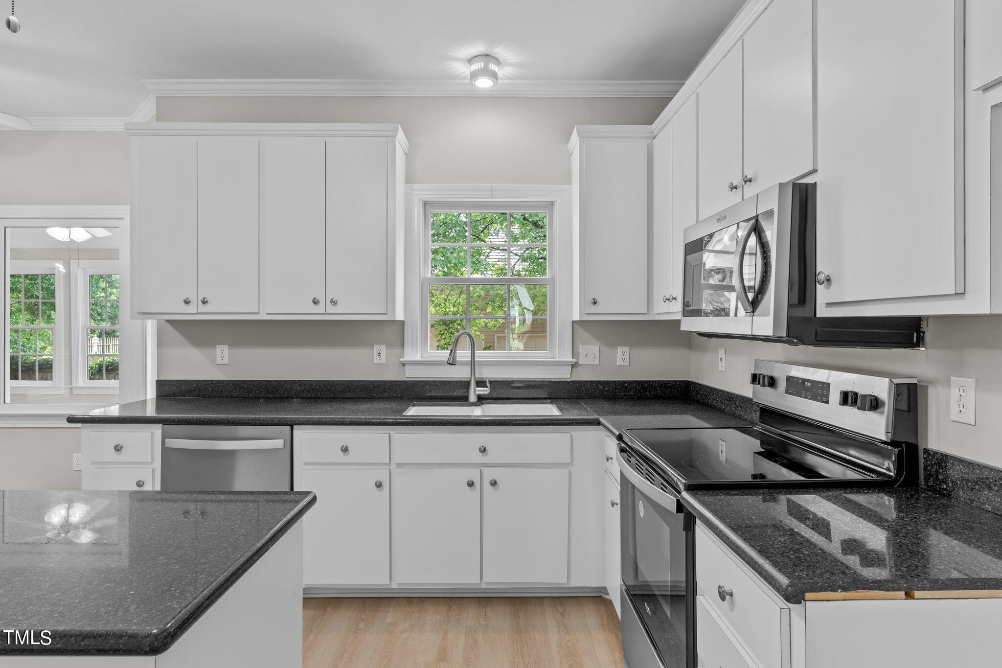 206 Palace Green Cary, NC 27518 - Photo 10 of 51 a kitchen with granite countertop a sink a stove and cabinets