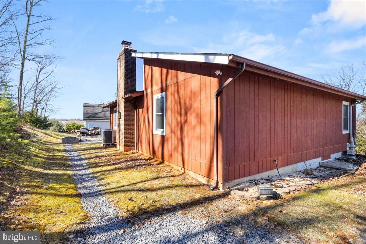 107 Gloucester Road Front Royal, VA 22630 - Photo 18 of 22 a view of a house with backyard and sitting area