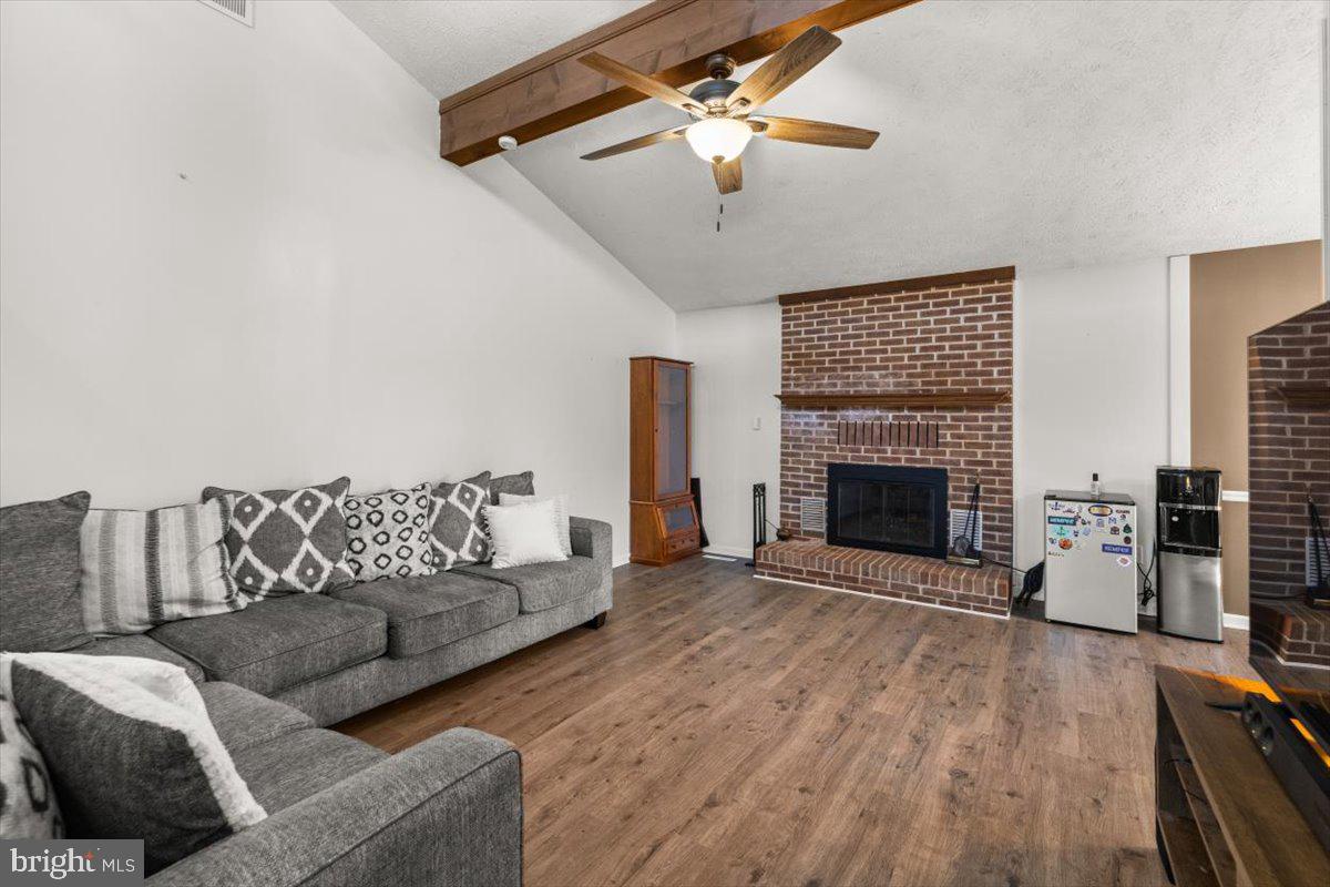 107 Gloucester Road Front Royal, VA 22630 - Photo 5 of 22 a living room with furniture and a fireplace