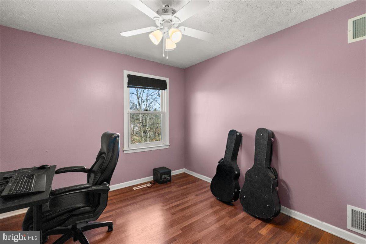 107 Gloucester Road Front Royal, VA 22630 - Photo 8 of 22 a view of a workspace with furniture and a window