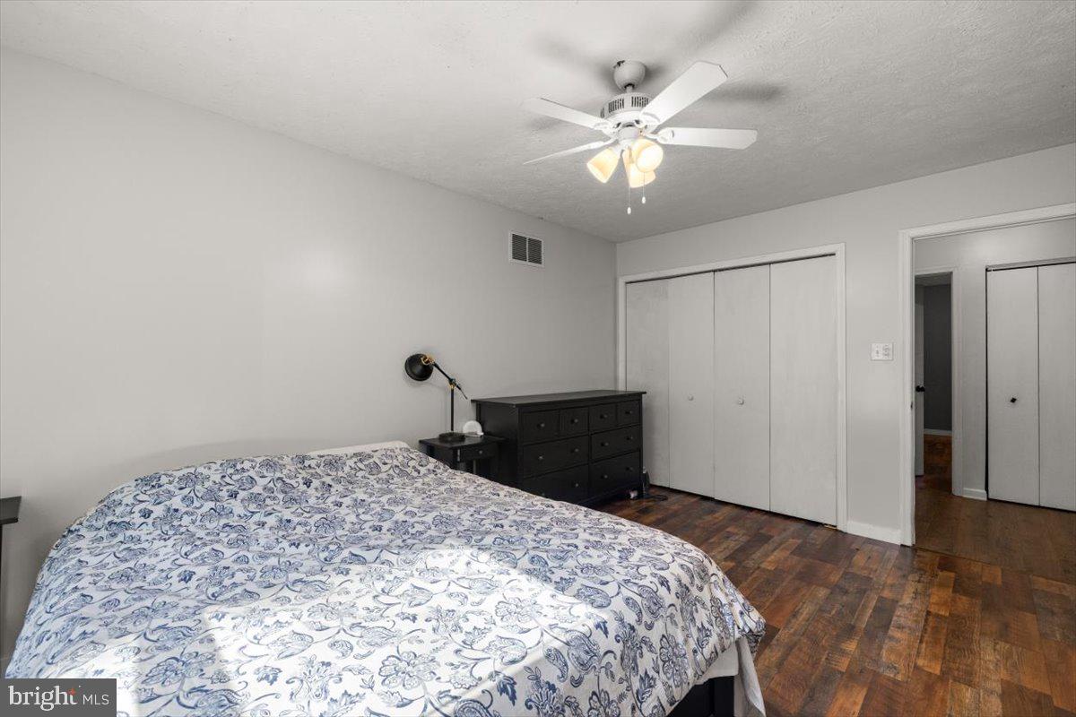 107 Gloucester Road Front Royal, VA 22630 - Photo 10 of 22 a bedroom with a bed and a chandelier
