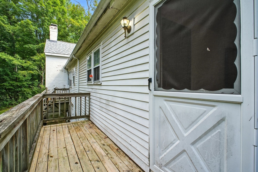 167 Warren Wright Road Belchertown, MA 01007 - Photo 18 of 42 a view of balcony with wooden floor and deck