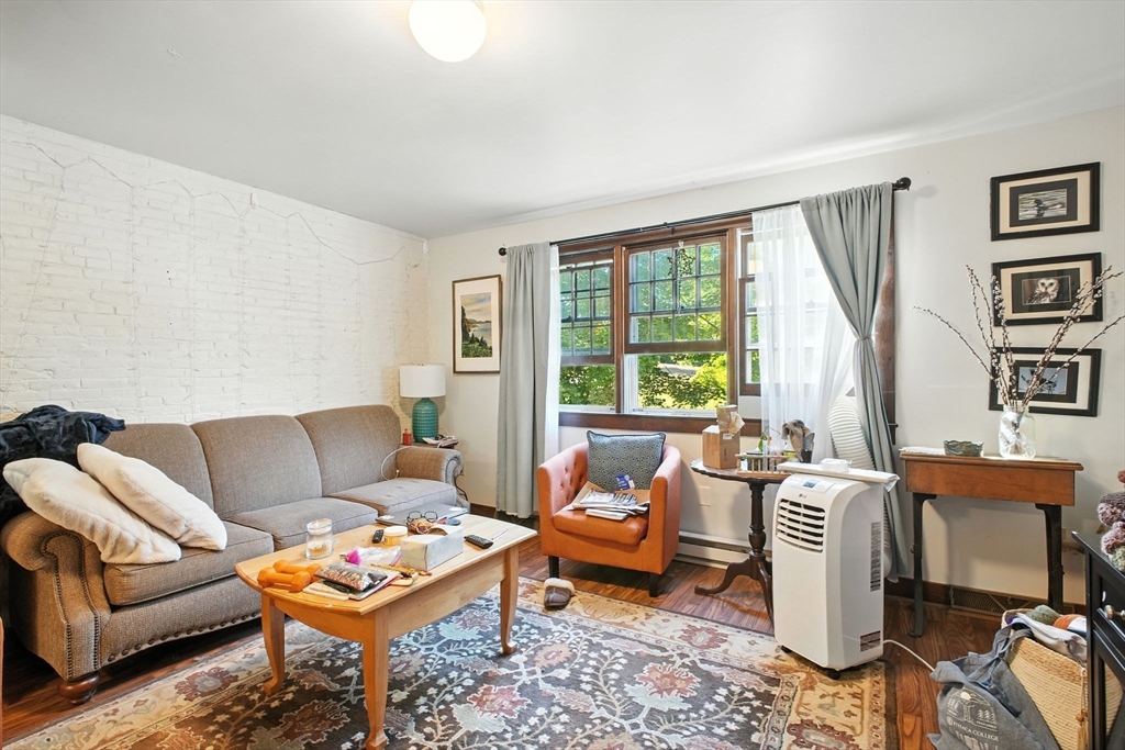 167 Warren Wright Road Belchertown, MA 01007 - Photo 21 of 42 a living room with furniture and a large window